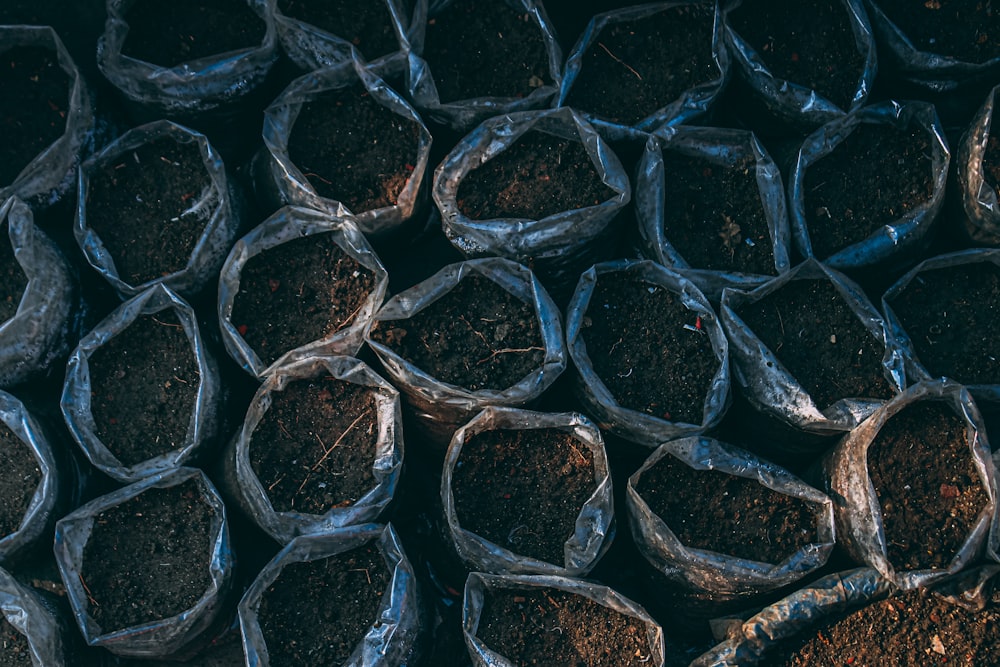 a bunch of bags filled with dirt and dirt