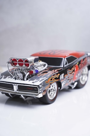 Classic muscle car diecast models lined up with vibrant paint finishes.
