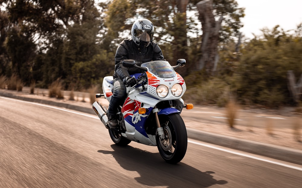 a person riding a motorcycle on a road