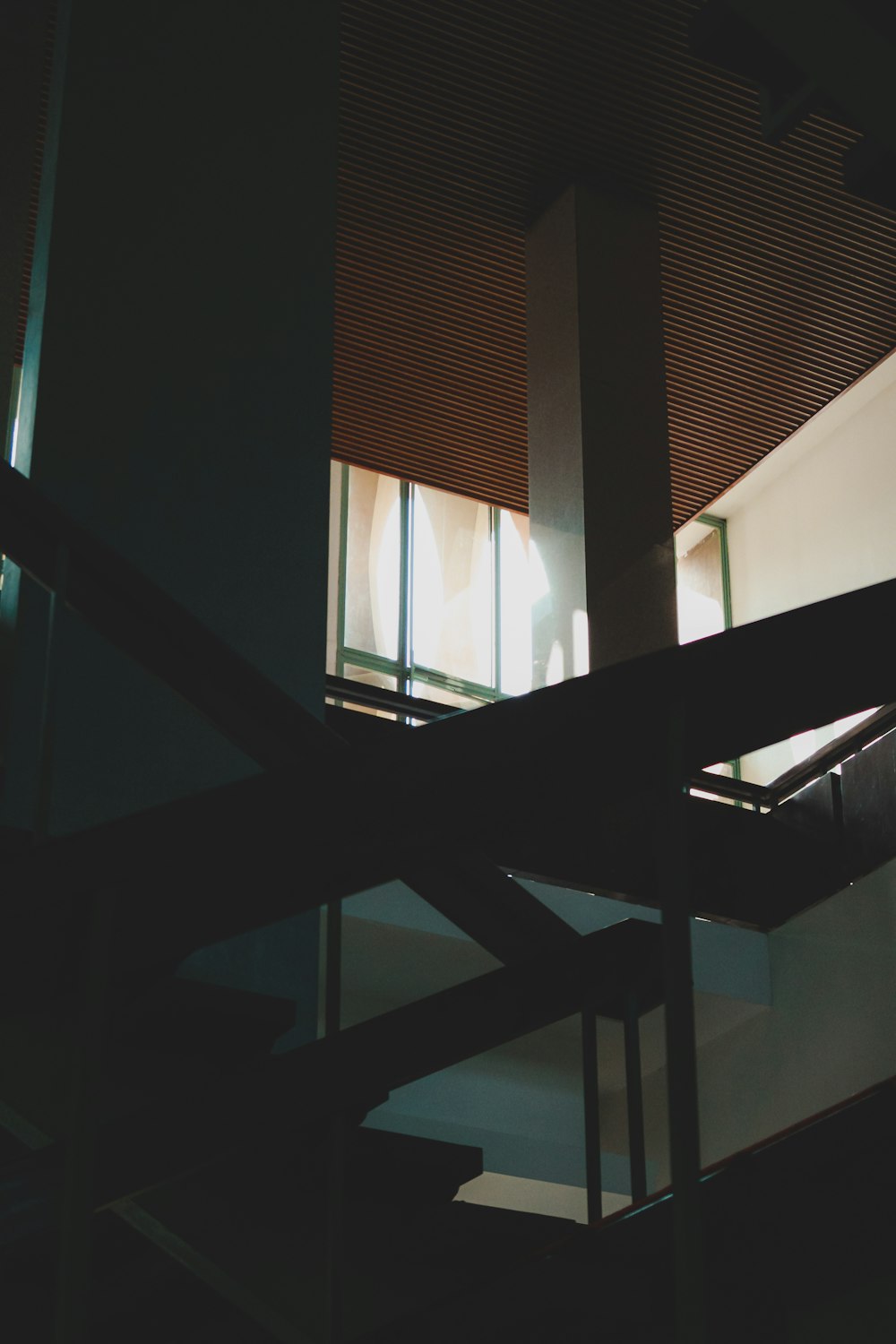 a person walking up a set of stairs in a building