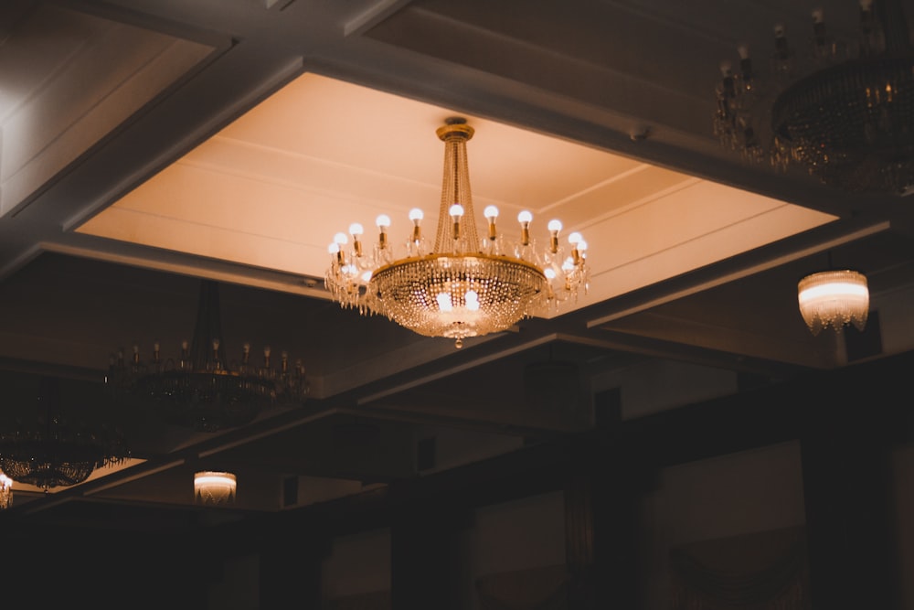 a chandelier hanging from a ceiling in a room