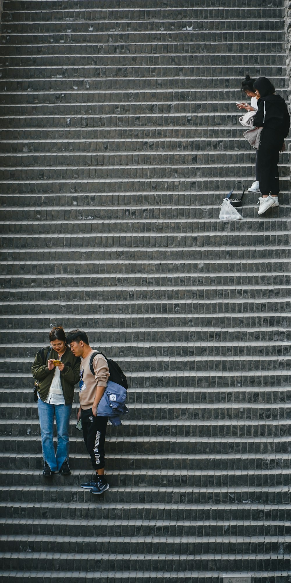 a couple of people that are walking up some stairs