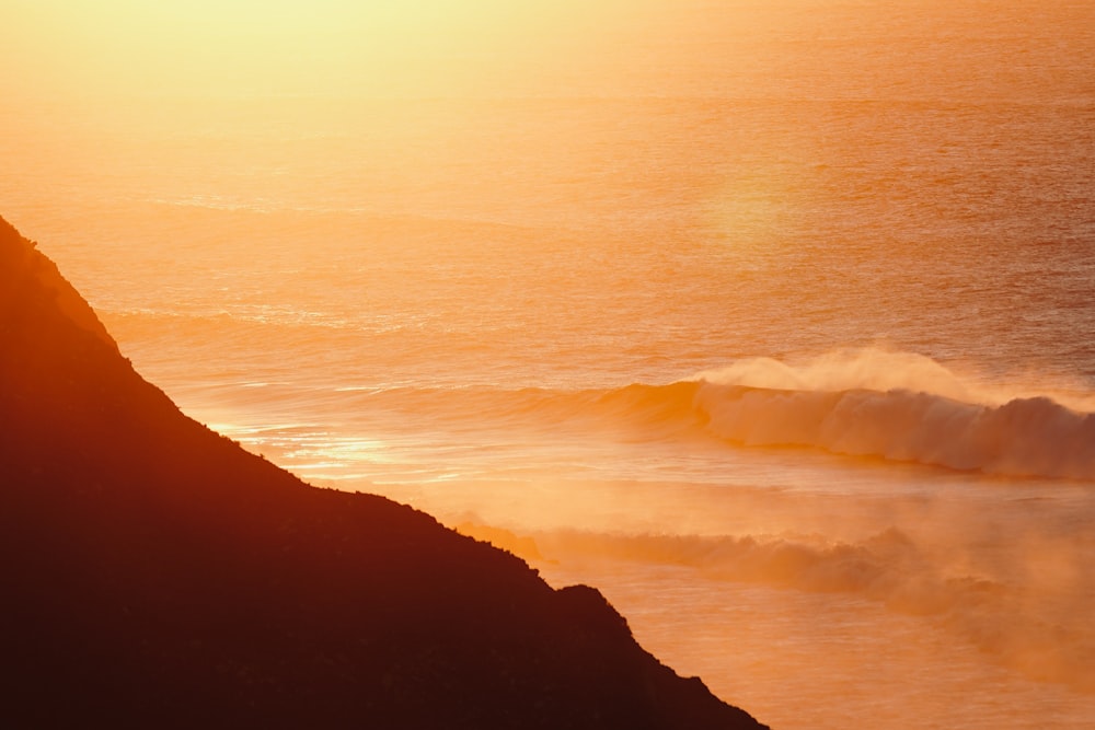 a person riding a surfboard on a wave in the ocean