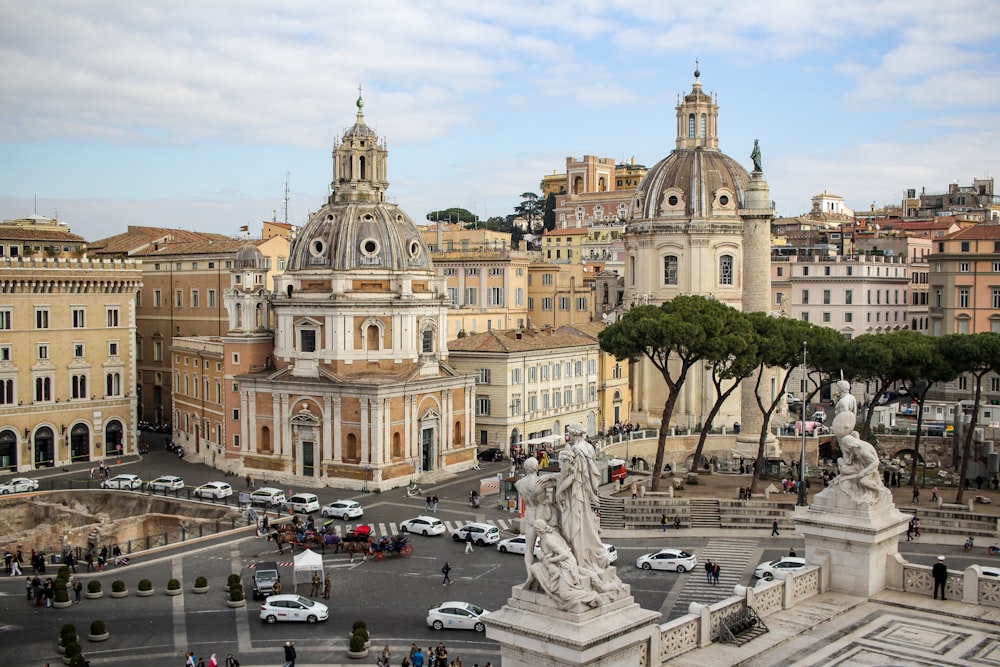 a view of a city with a statue in the middle of the street