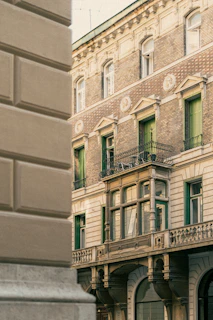 A close-up of colonial-era architectural details, featuring arches and wrought iron balconies