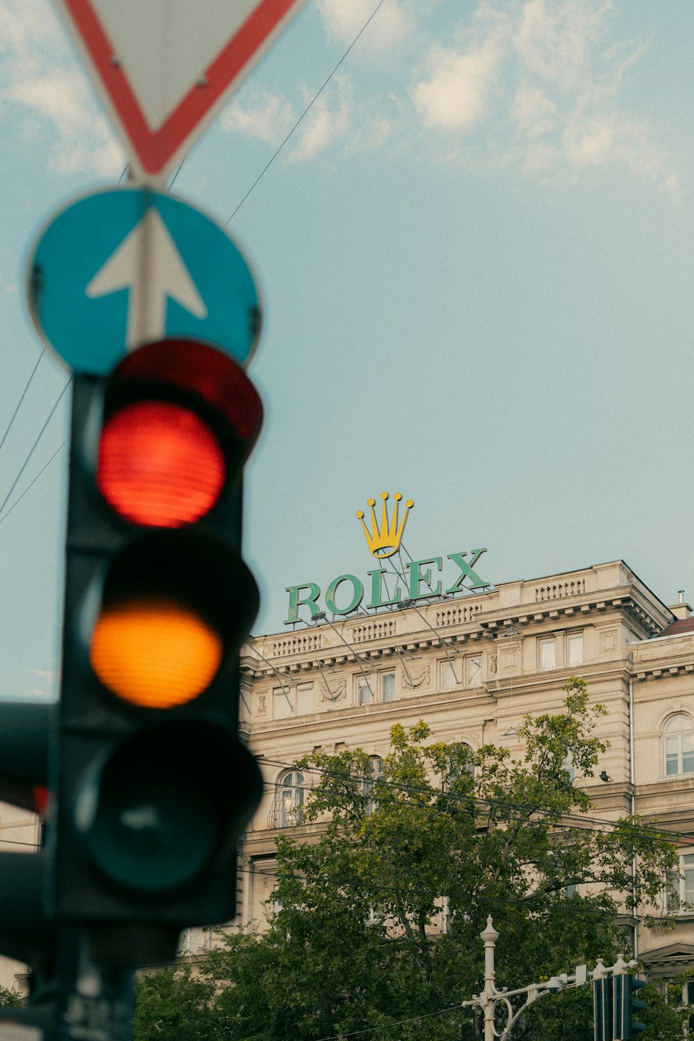 a traffic light with a building in the background