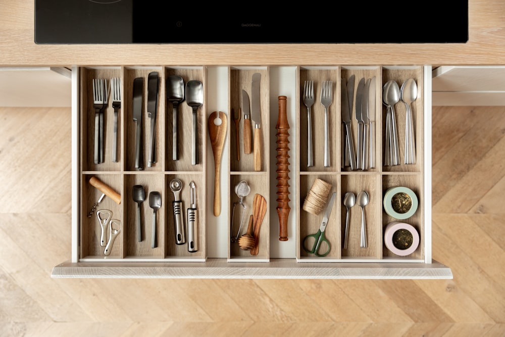 a drawer filled with different types of utensils