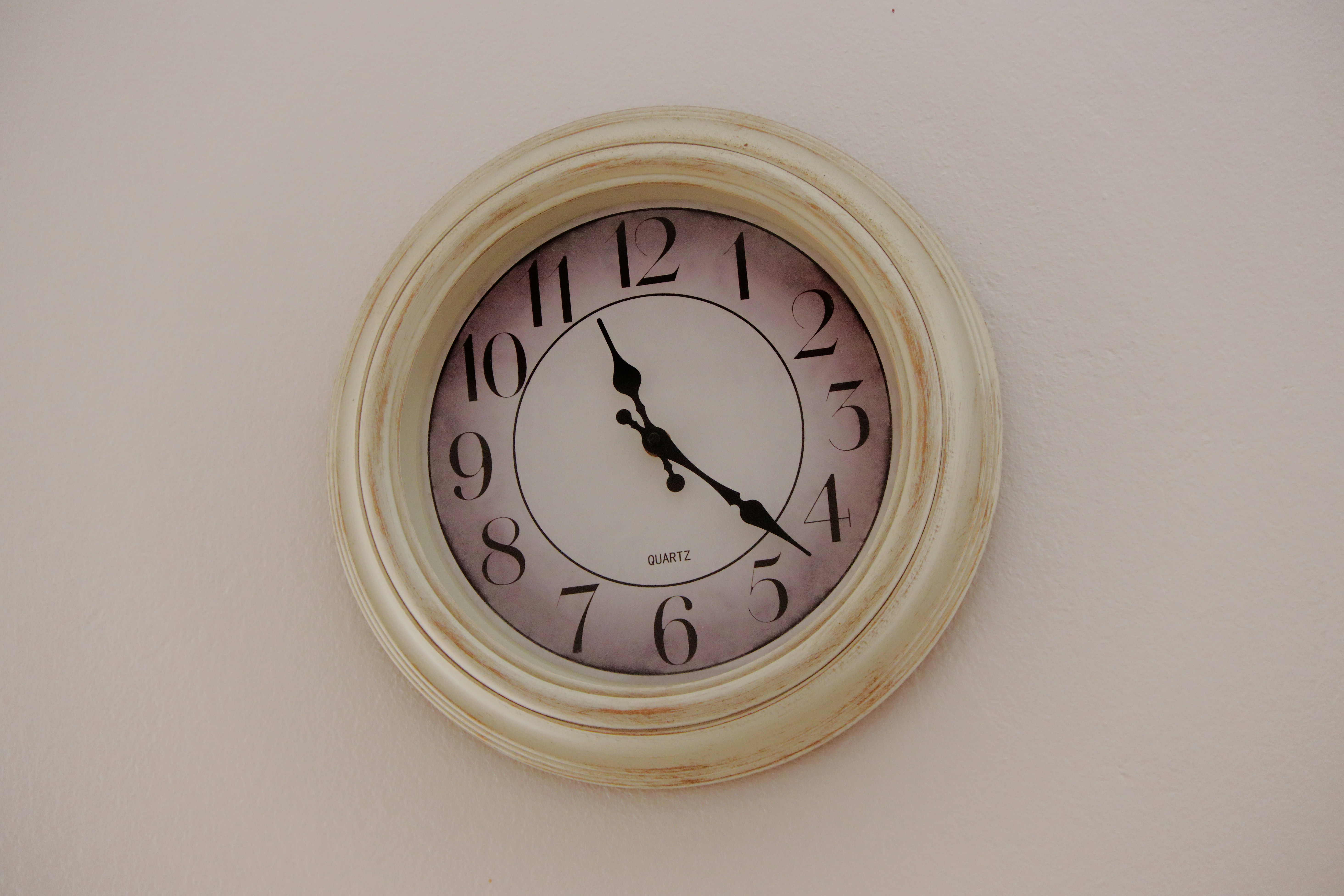 a clock on a wall with numbers on it