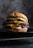 A juicy double cheeseburger is placed on a dark textured surface. It contains two beef patties layered with melted cheese, slices of pickle, fresh onions, and is topped with a soft, golden bun. The lighting highlights the textures and details of the ingredients.