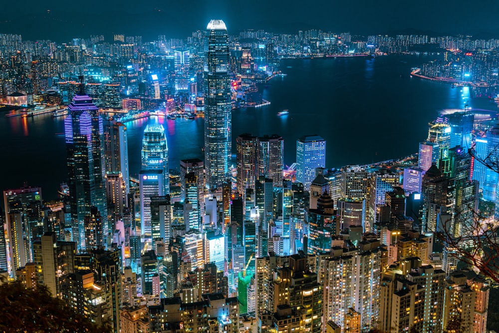 a view of a city at night from the top of a hill