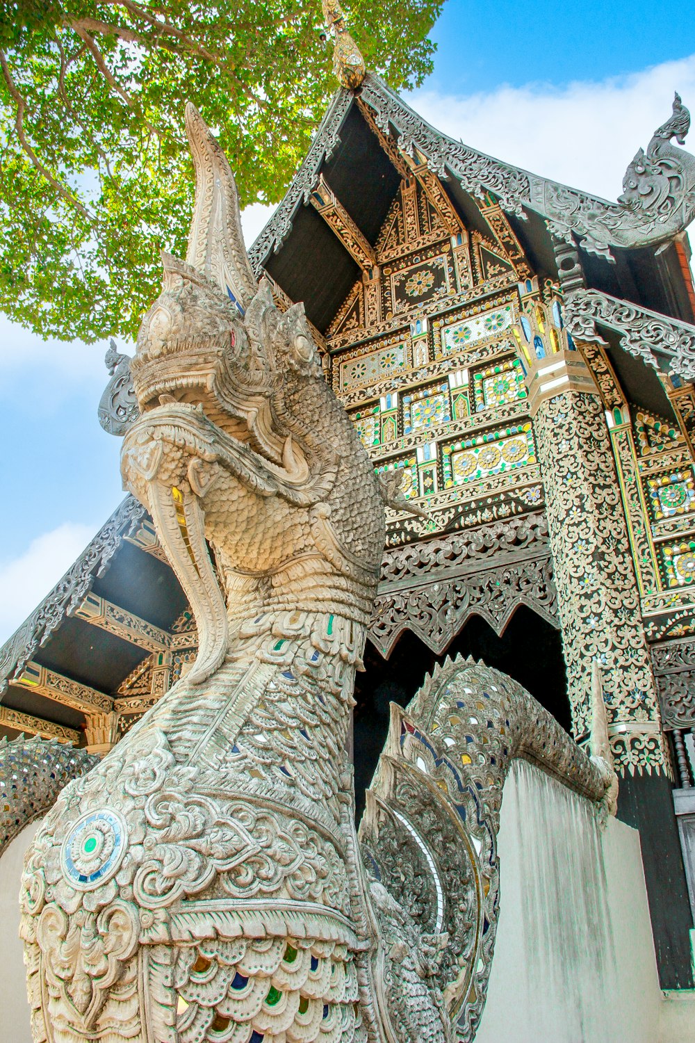 a statue of an elephant in front of a building