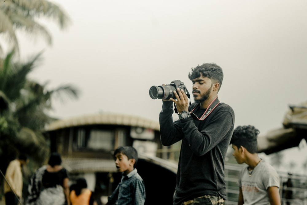 a man taking a picture of a group of people