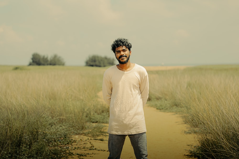 a man standing in the middle of a field