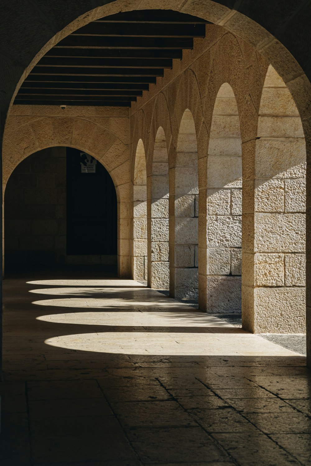 a row of arches in a stone building