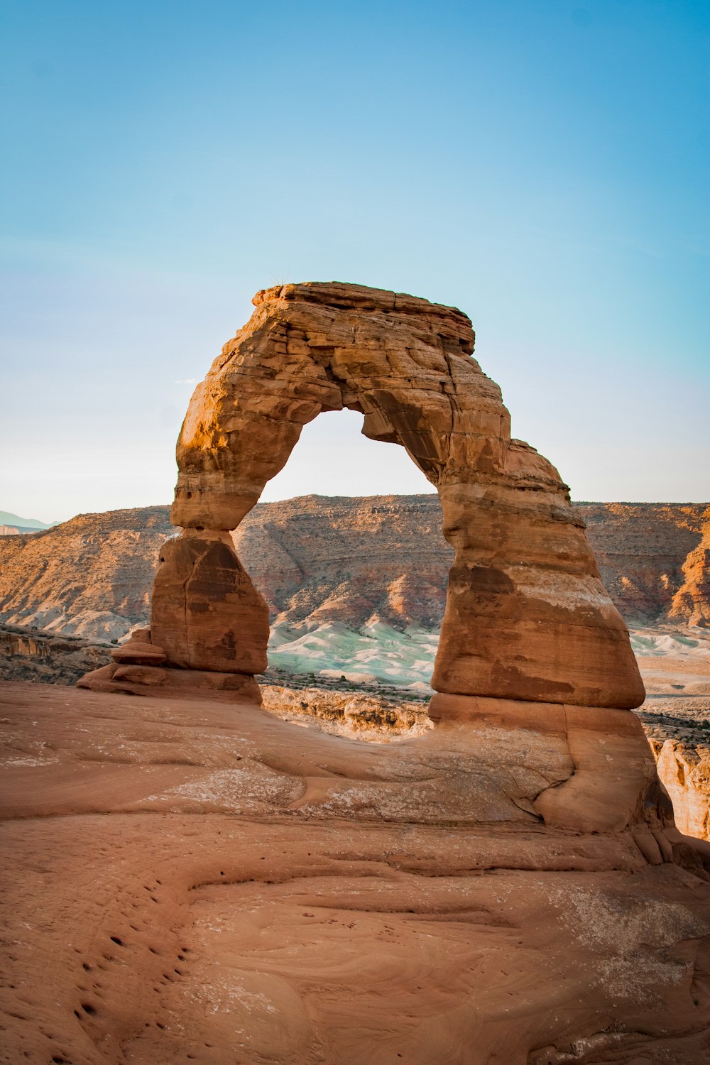 a large rock formation in the middle of a desert