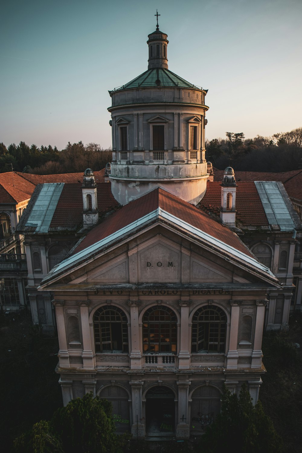 an old building with a steeple and a clock tower