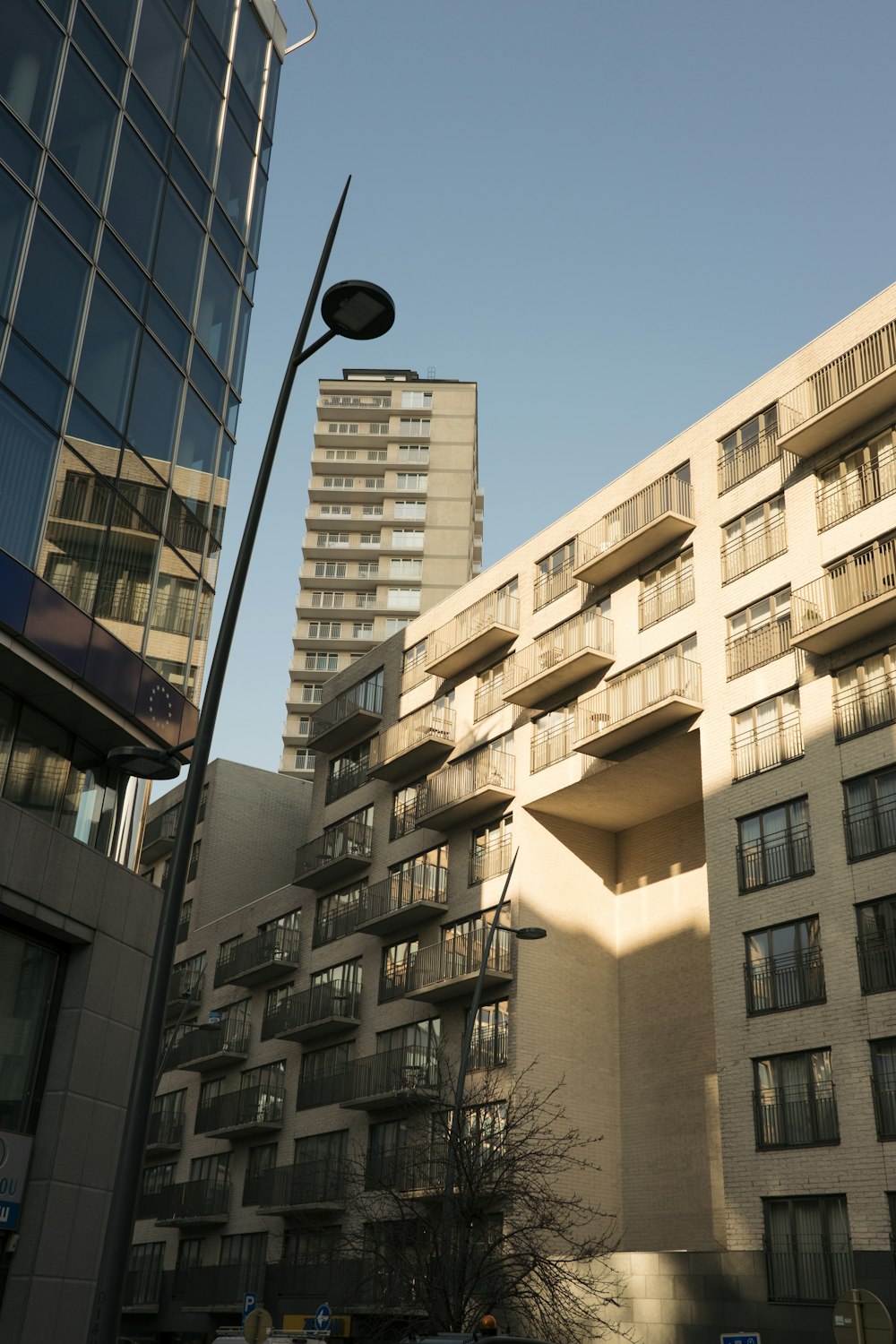 a tall building next to a street light