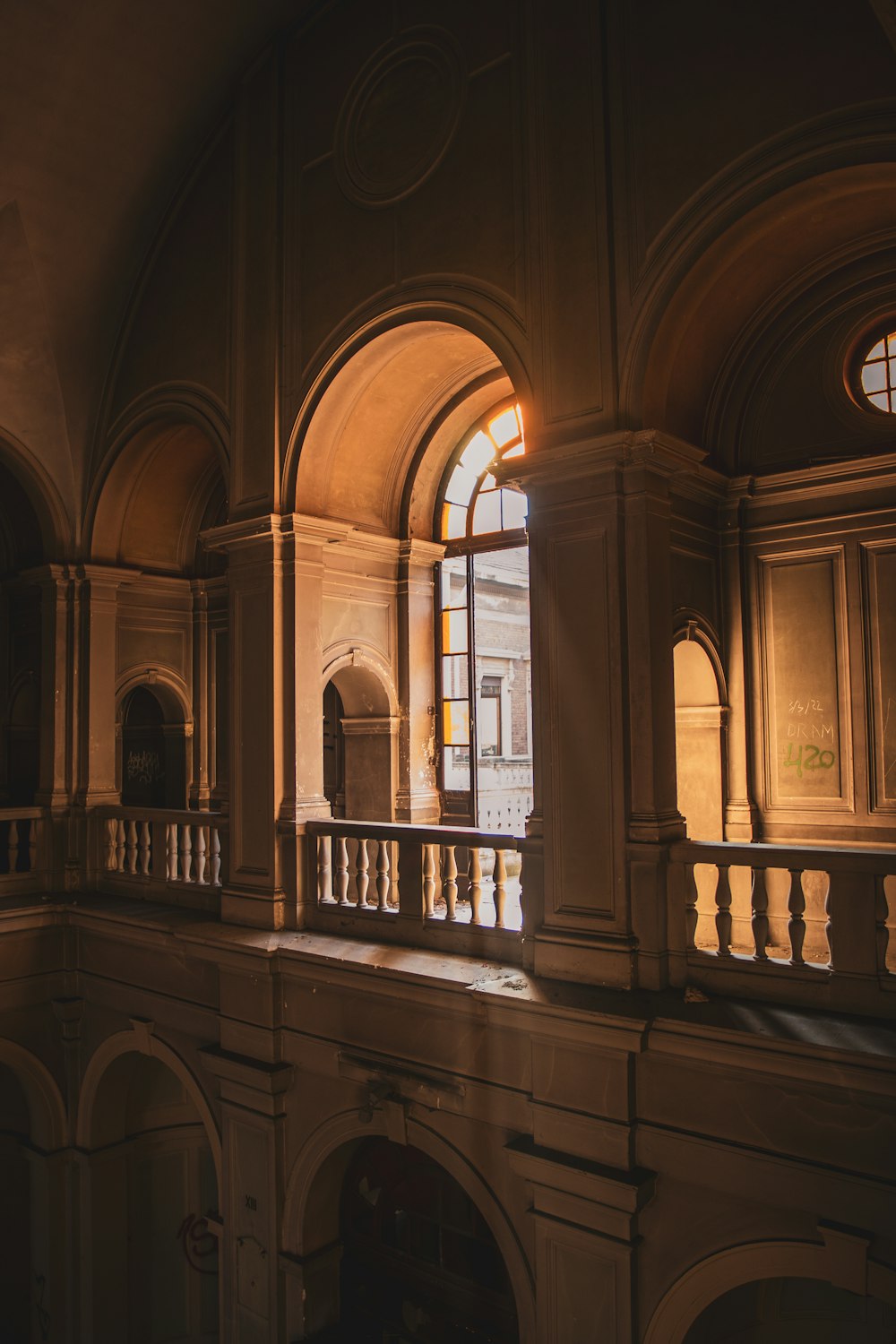 a large building with arched windows and a balcony