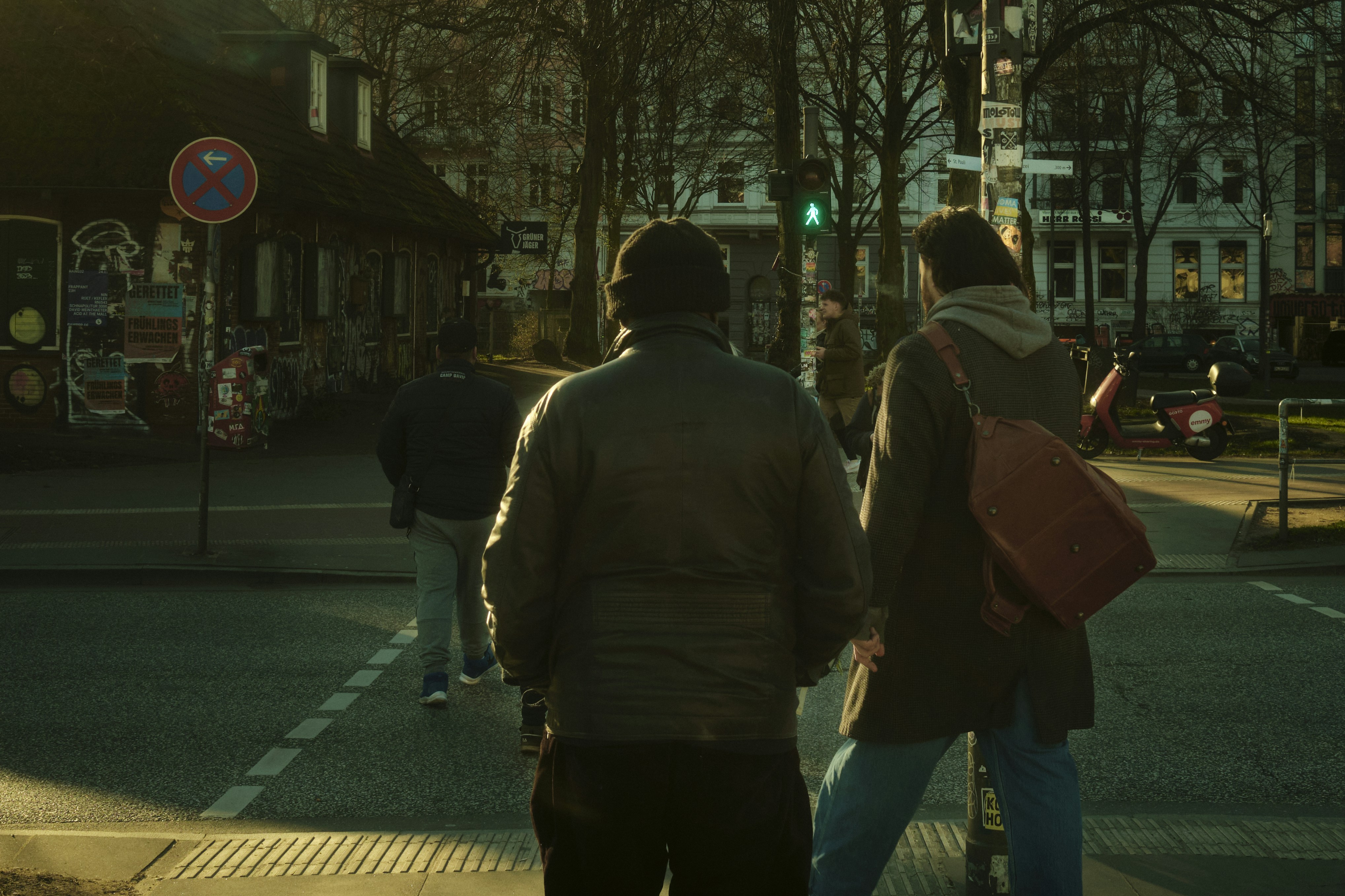 a couple of people that are walking down the street
