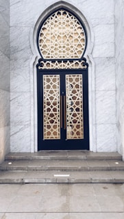 A beautifully carved marble entrance with intricate patterns showcasing natural stone craftsmanship.