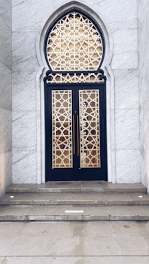 A beautifully carved marble entrance with intricate patterns showcasing natural stone craftsmanship.