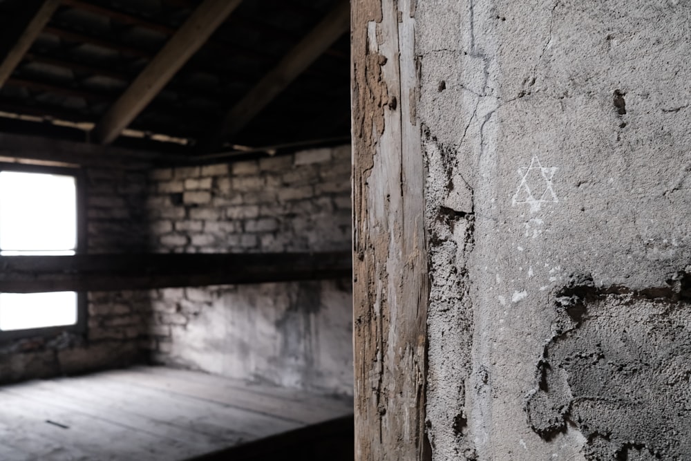 a room with a brick wall and a wooden floor