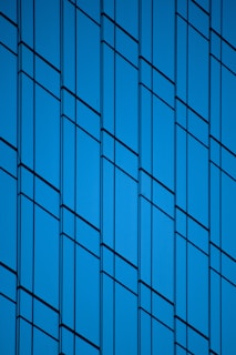 an airplane is flying in the blue sky