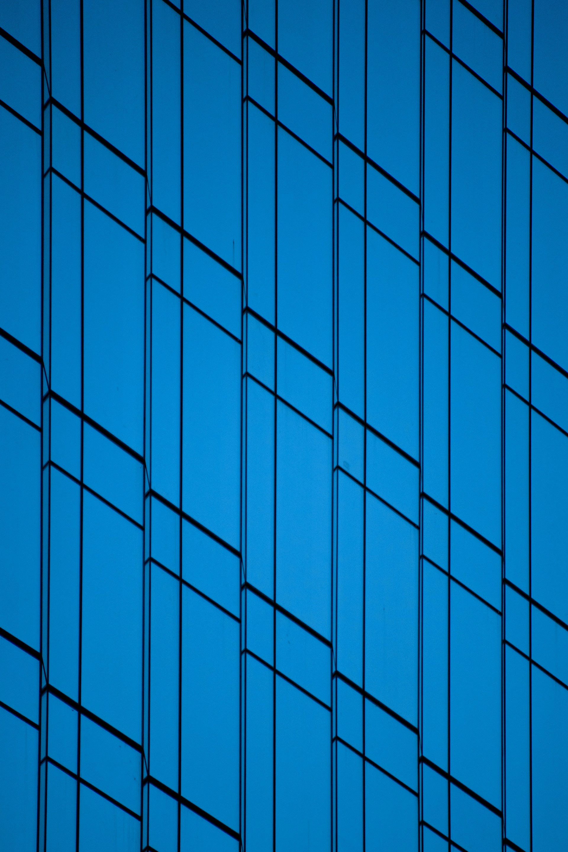 an airplane is flying in the blue sky