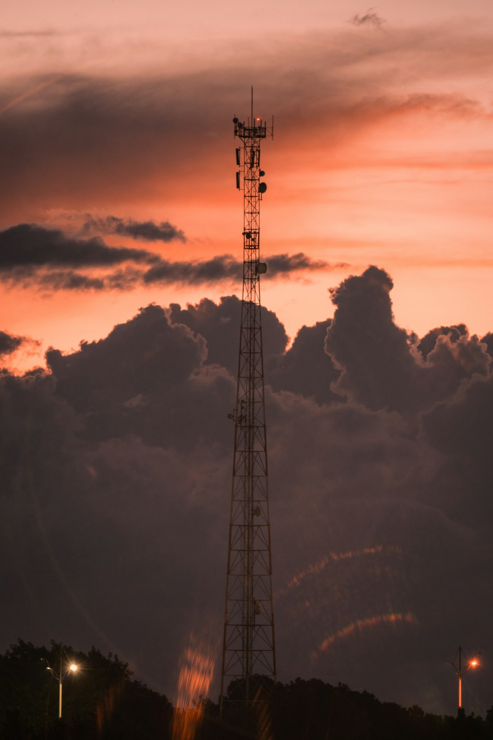 a tall tower sitting under a cloudy sky