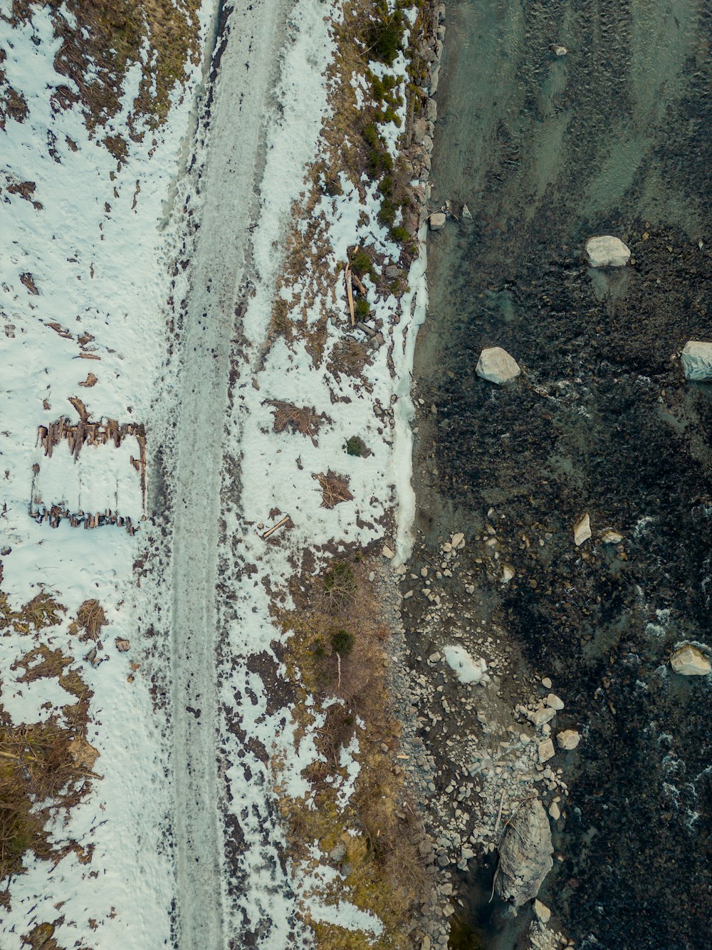 an aerial view of a snow covered road