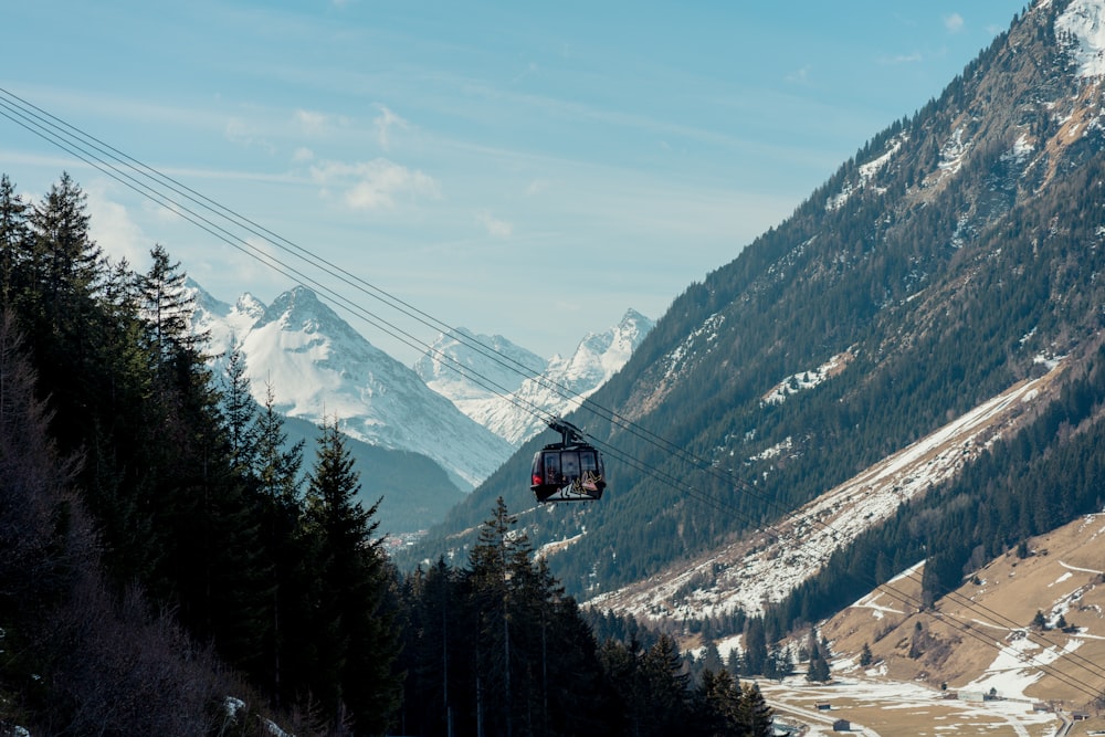 a ski lift going up the side of a mountain