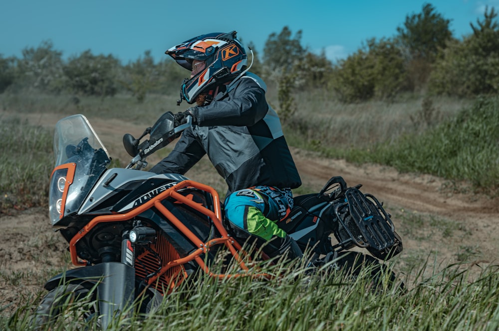 a person riding a motorcycle on a dirt road