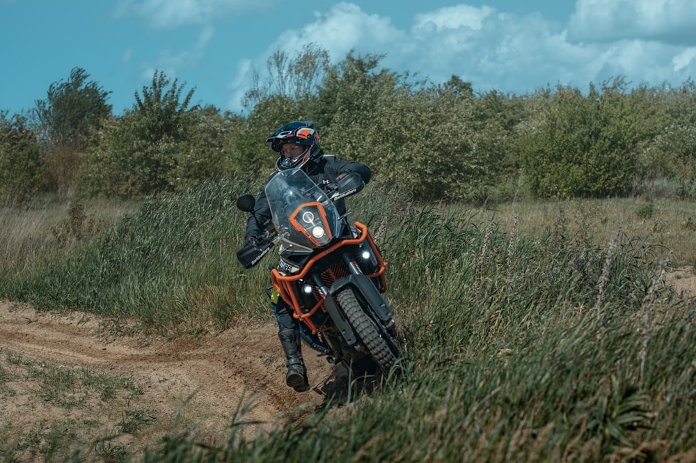 a person riding a motorcycle on a dirt road