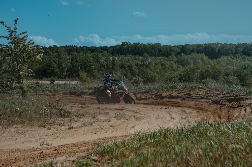 a person riding a four wheeler on a dirt road