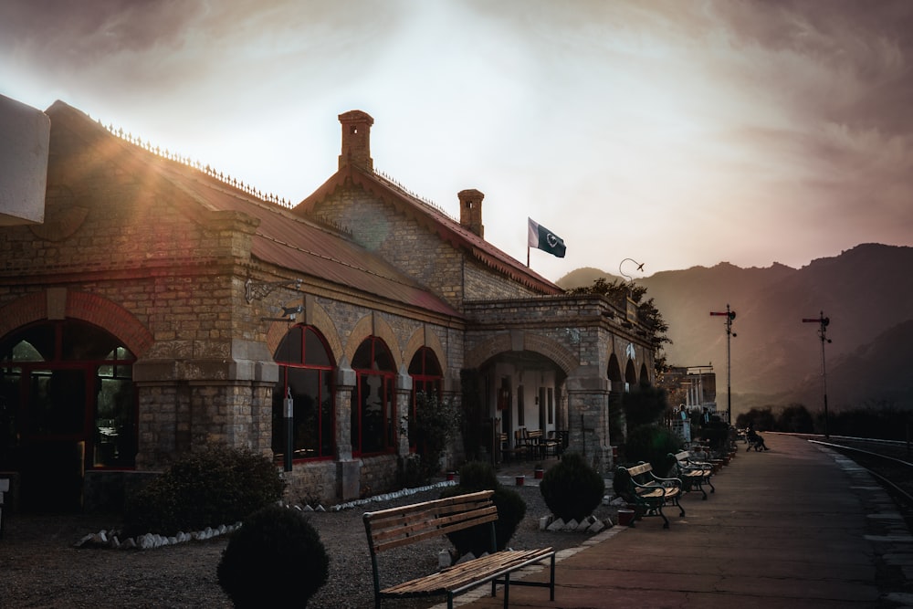 a train station with benches on the side of it