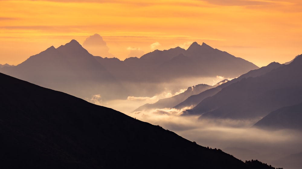 a view of a mountain range at sunset