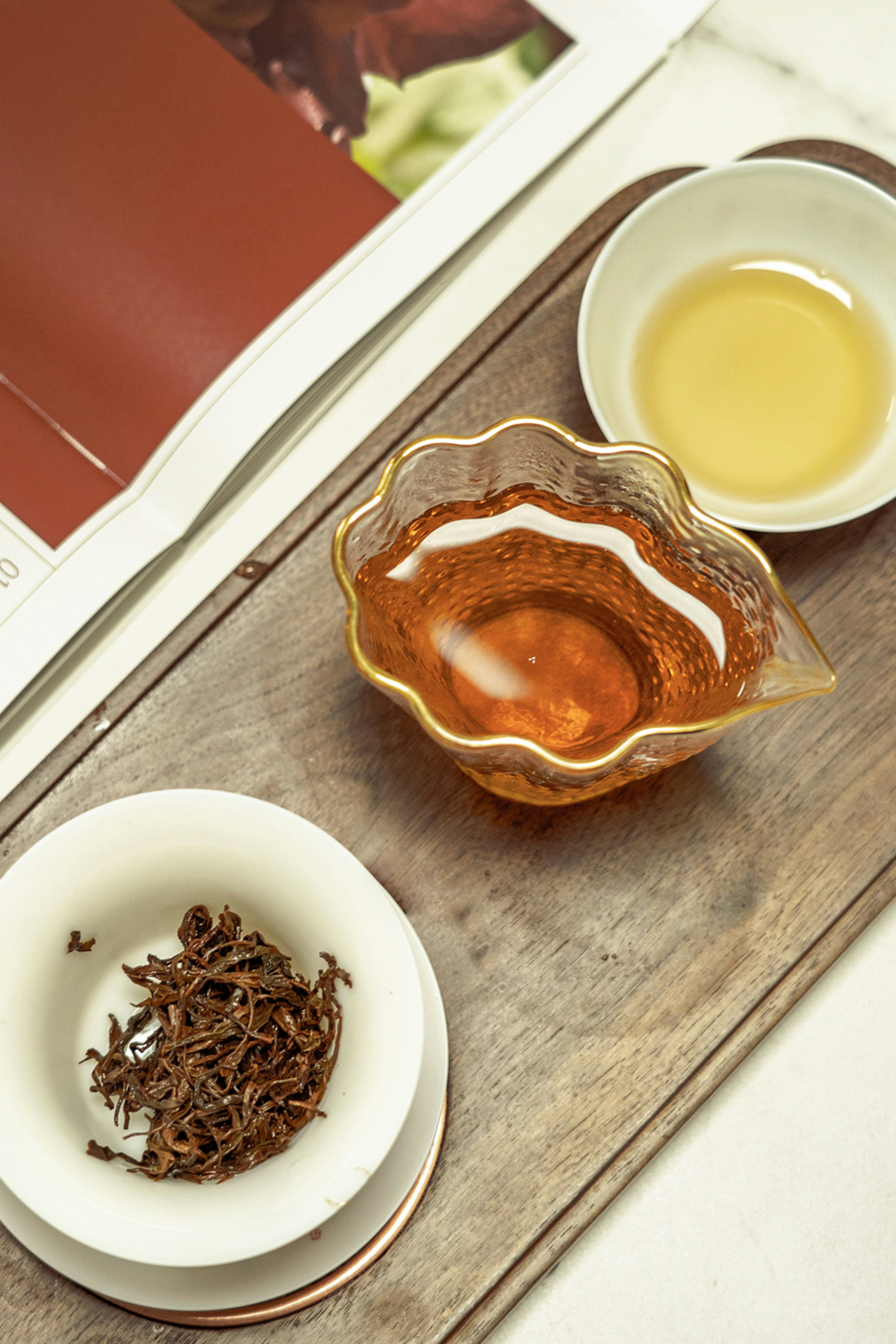 a cup of tea next to a bowl of tea