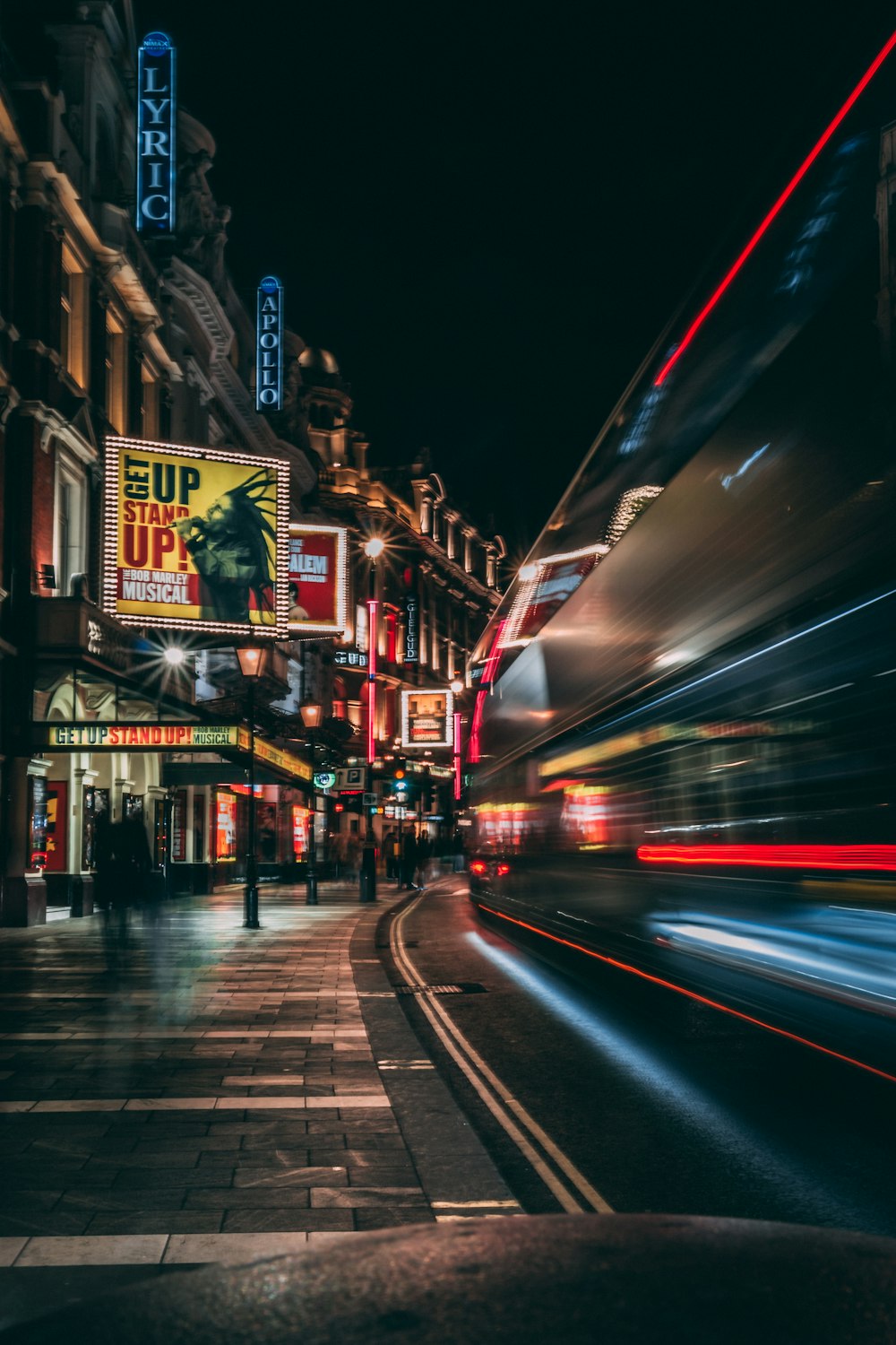 a blurry photo of a city street at night