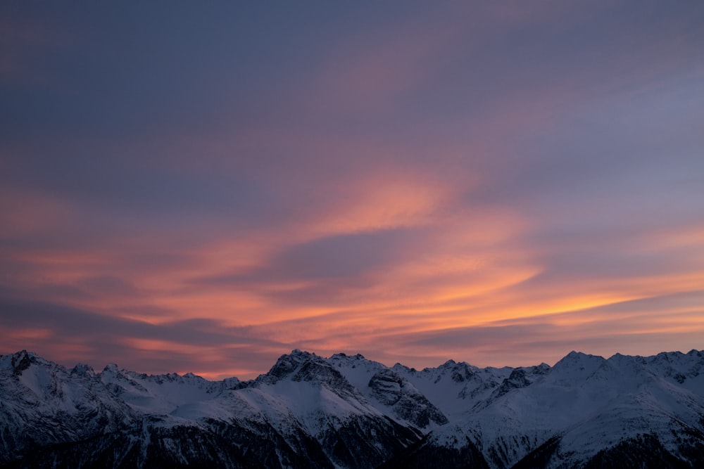 a view of a mountain range at sunset