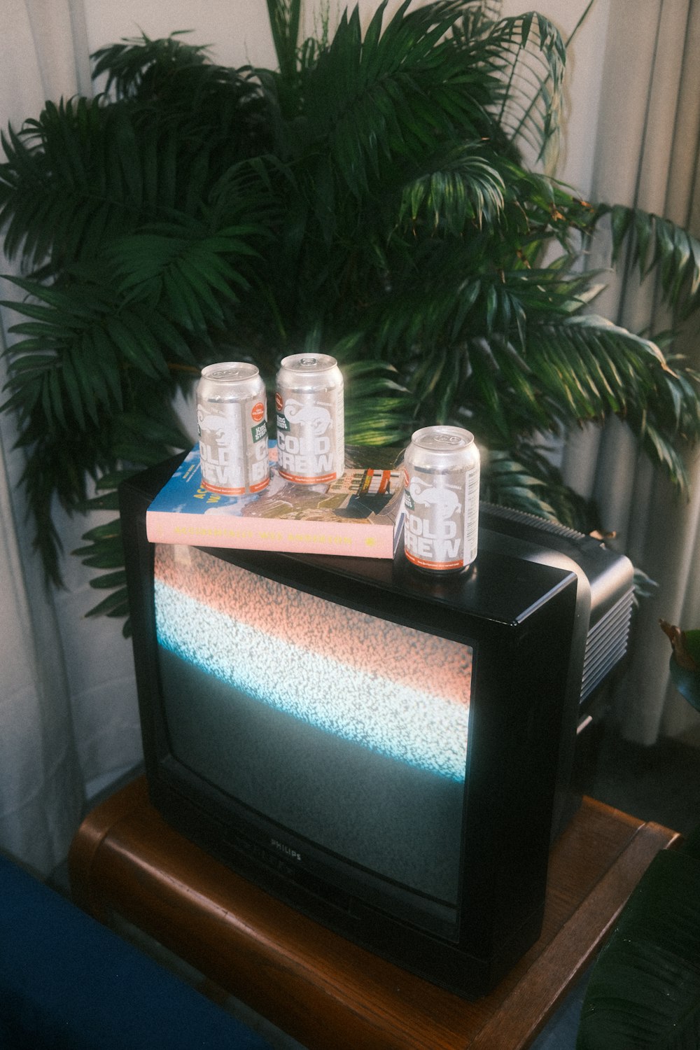 a television set sitting on top of a wooden table