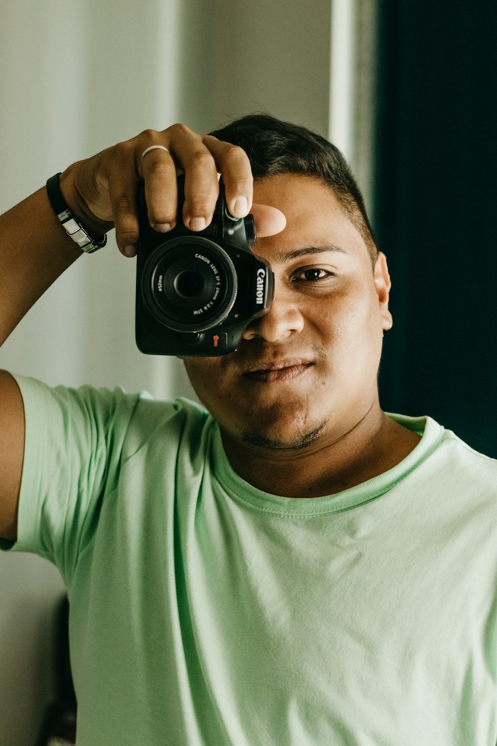 a man taking a picture of himself with a camera