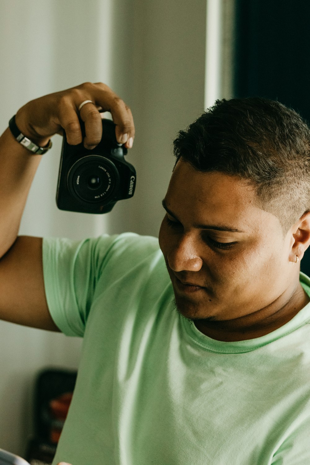 a man taking a picture of himself with a camera