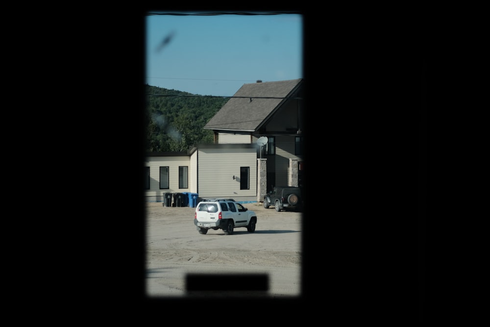 a car is parked in front of a house