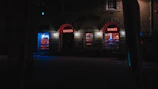 Exterior shot of the bar at dusk, neon sign glowing with Texas charm along I-35.
