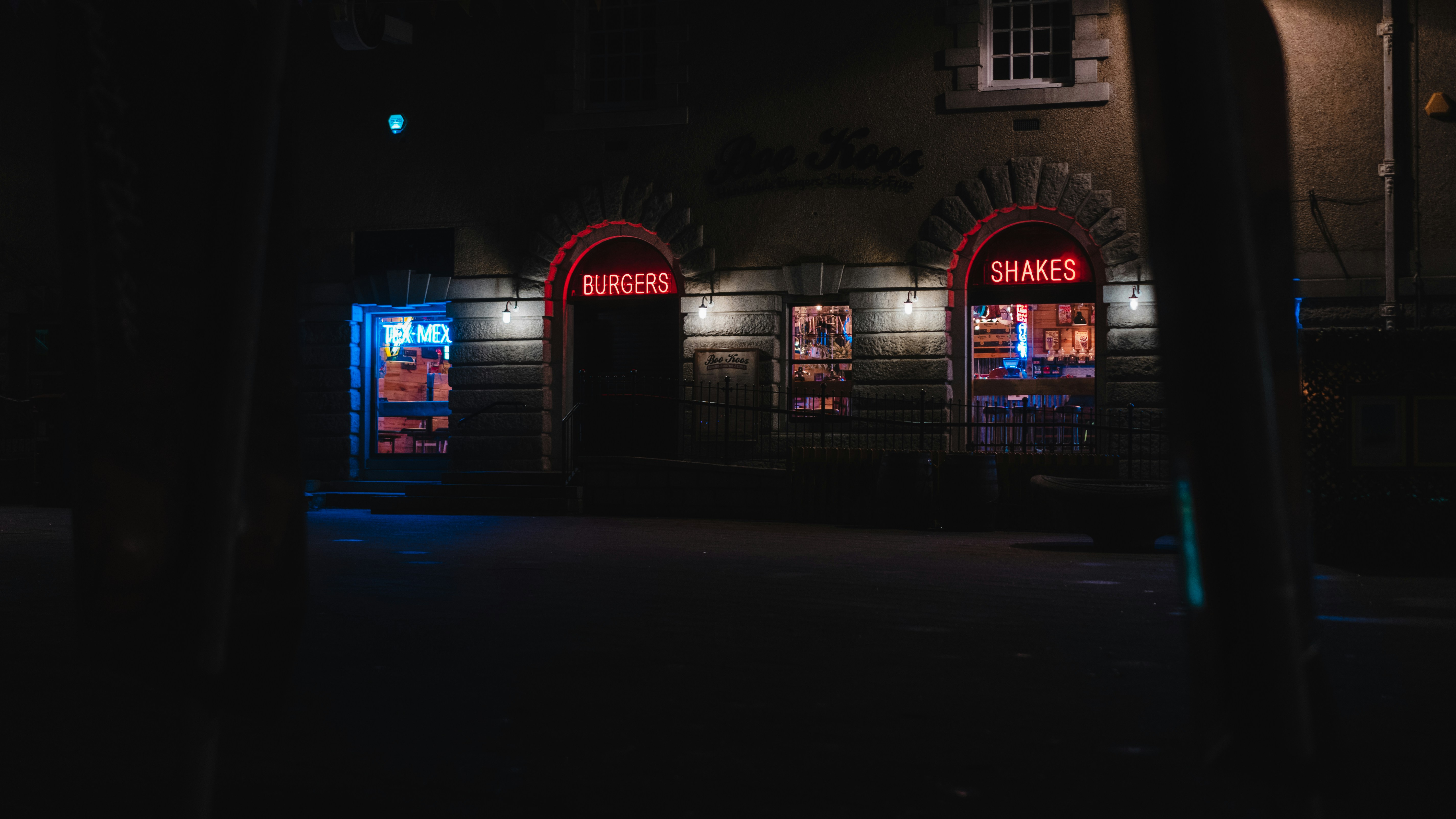 Historic facade of FitzGerald's Nightclub in Berwyn, illuminated at night, with patrons entering