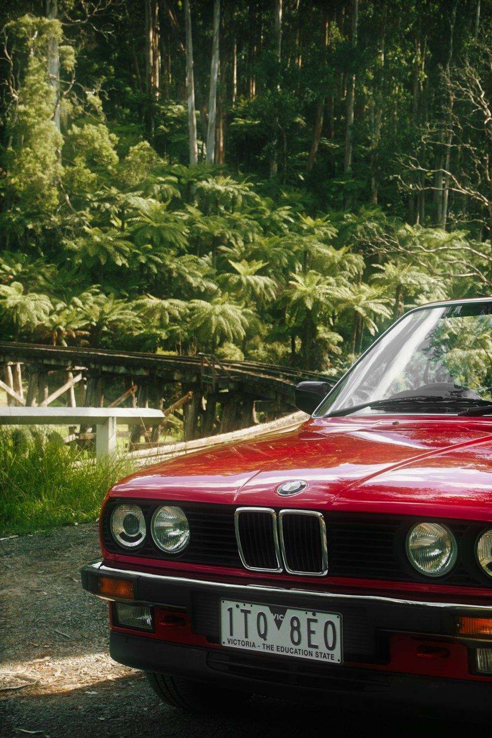 a red car parked on the side of the road