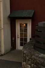 Close-up of a sleek air curtain installed above a commercial doorway, gently flowing air to keep the environment clean.