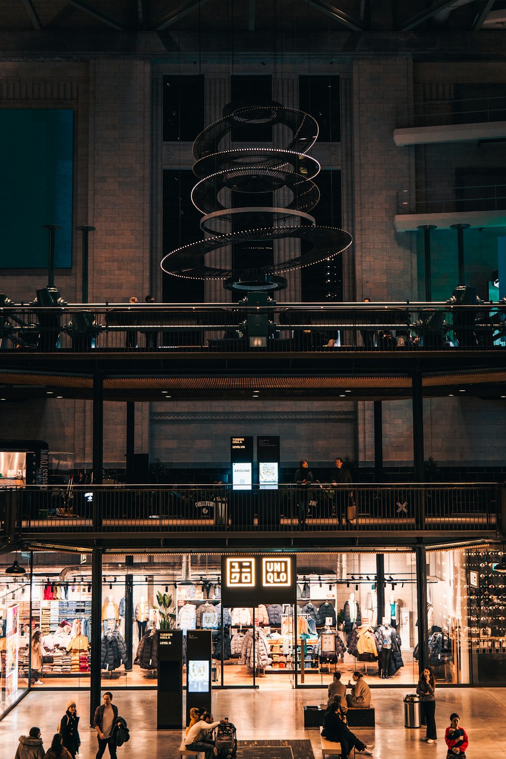 a group of people walking around a building