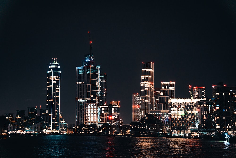 a night view of a city with a lot of tall buildings