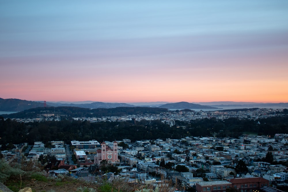 a view of a city with mountains in the background